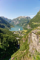 Fototapeta na wymiar Geirangerfjord with cruise ship, view from Flydalsjuvet viewing point, Norway. Travel destination