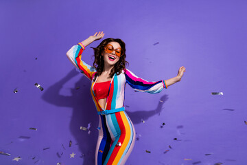 Photo of pretty sweet girl dressed striped overall dark eyewear having disco fun isolated violet color background