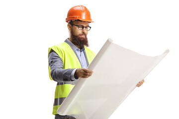 Site engineer with a helmet reading a blueprint