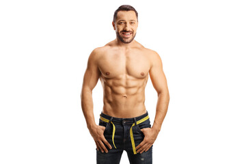 Fototapeta na wymiar Topless man wearing jeans with a measuring tape around waist