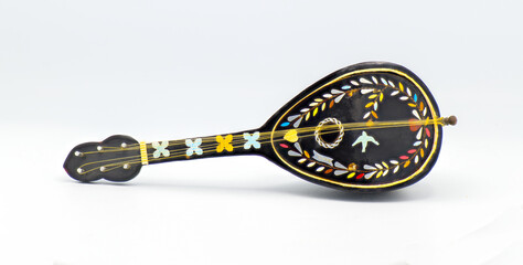 Beautiful black old antique bouzouki toy music box with multi colored ornate inlay of yellow, blue,...