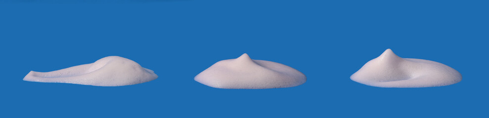  Foam texture, white bubbles from soap or shampoo or shower gel and facial foam. isolated on blue...