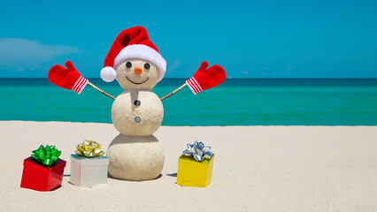 Snowman. Sandy Snowman on the beach. Christmas snowman with red Santa Claus hat and mittens. Smiley...