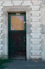 old green wooden doorway entrance exit building glass windows