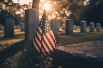 Generative AI image of American national flag with stars and stripes placed on green grass near tombstone in cemetery against bright sunset light and blurred trees