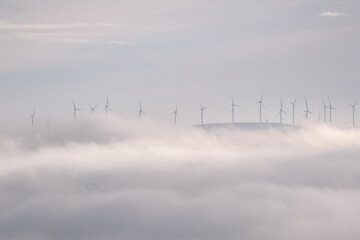Fototapeta na wymiar electric power generation from wind farm windmills