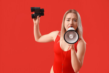 Female lifeguard with binoculars shouting into megaphone on red background