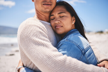 Obraz premium Love, hug and relax with couple at beach for travel, summer vacation and romance together. Calm, embrace and bonding with man and woman walking on seaside holiday for care, date or honeymoon