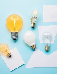 Various types of white and yellow light bulbs with a blue background.