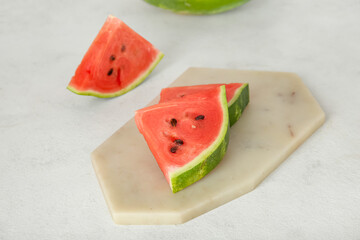 Pieces of ripe watermelon on light background, closeup