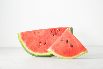 Pieces of ripe watermelon on light background, closeup