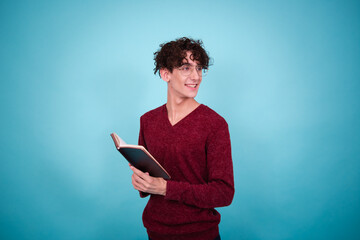 Young attractive guy posing in the studio. The student is in college.