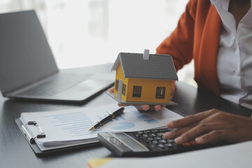 Real estate agent and customer signing contract to buy house, insurance or loan real estate.rent a house,get insurance or loan real estate or property.