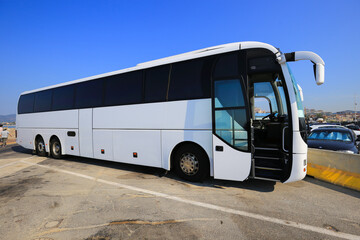 Big white bus in the parking lot