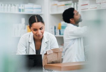 Woman, pharmacist and team in inventory inspection or checking stock or medication at the pharmacy. People, medical or healthcare professional looking at pharmaceuticals together at the drugstore