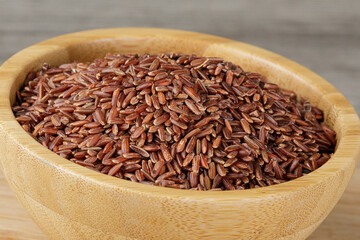 Wooden Bowl of delicious and healthy Red Rice