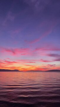 Vertical video of beautiful sunset on the Iznik Lake. 4k, 60fps video. Bursa, Turkey

