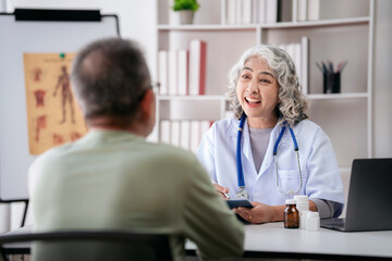 Female doctor writing prescription on clipboard while explaining medicine use and discussing about