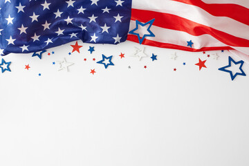 Picturing a vibrant concept for a happy Labor Day celebration. Top view photo of USA national flag, star-shaped confetti on white background with empty space for advert or text - Powered by Adobe
