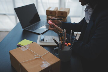 Starting small businesses SME owners female entrepreneurs Write the address on receipt box and check online orders to prepare to pack the boxes, sell to customers, sme business ideas online.