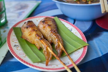 Grilled or barbecue chicken wings skewer, Thai traditional street food style.