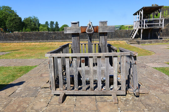 Caerphilly Castle in Caerphilly in South Wales United Kingdom and catapult is a ballistic device used to launch a projectile a great distance without the aid of gunpowder or other propelants