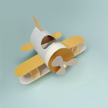 The idea of recycling a roll of toilet paper into a toy airplane. Craft idea for children's creativity