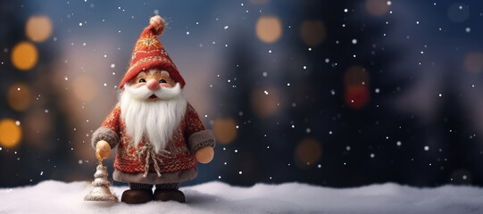 Embroidered santa claus doll on snow background with bokeh and snowflakes, space for text.