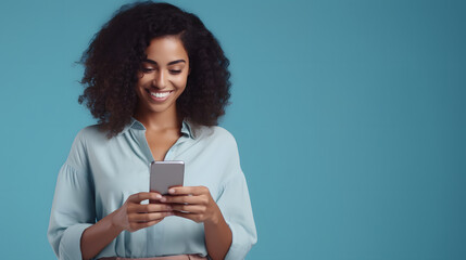 Young adult smiling happy pretty latin woman holding mobile phone looking at smartphone, typing message doing ecommerce shopping on cell, using trendy apps on cellphone isolated on blue background 
