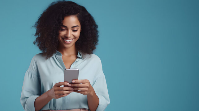 Young Adult Smiling Happy Pretty Latin Woman Holding Mobile Phone Looking At Smartphone, Typing Message Doing Ecommerce Shopping On Cell, Using Trendy Apps On Cellphone Isolated On Blue Background 
