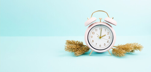 Alarm clock with christmas decoration, end of daylight saving time in fall, winter time changeover
