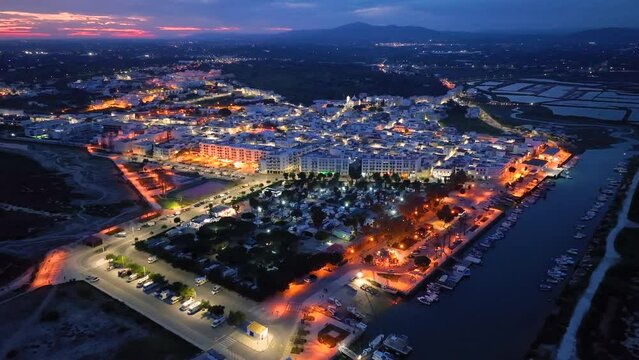 Sunset in Fuseta from an aerial drone view. Olh&atilde;o Municipality. Lighthouse district. Marshes and salt flats of the Ria Formosa Natural Park. Atlantic Ocean. Algarve. Portugal. Europe