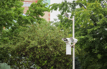 security cameras in public spaces symbolize modern surveillance, safety, and loss of privacy