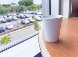 paper cup finds new purpose through recycling, embodying sustainability and environmental renewal