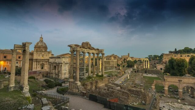 The Roman Forum and the remains of ancient Rome. Italy. 4K. The ruins of ancient Rome, the Roman Forum, the Colosseum. Timelapse from day to night rome night. Ancient Rome