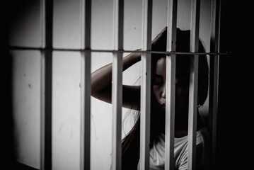 Hands of women desperate to catch the iron prison,prisoner concept,thailand people,Hope to be...