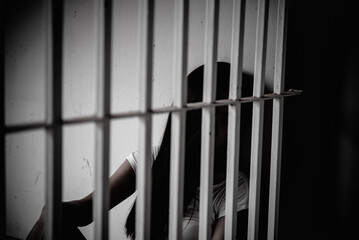 Hands of women desperate to catch the iron prison,prisoner concept,thailand people,Hope to be...