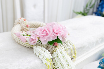 Thai traditional wedding accessories, The white garland made from jasmine on the ceremony table sets.