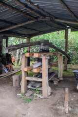 Fototapeta na wymiar Old machine to grind sugar cane, a treasure from the past that evokes the tradition and history of sugar production. A visual testimonial to engineering and hard work.
