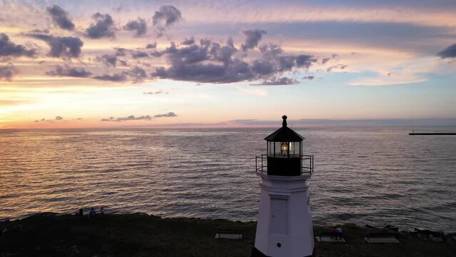 Historic Vermilion Light house along lake Erie Shore line in Vermilion, Ohio during sunset.