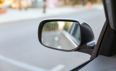 Car mirror: Reflection of journey, introspection, and transitions in a compact frame, capturing the road of life
