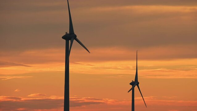 wind turbines at sunset