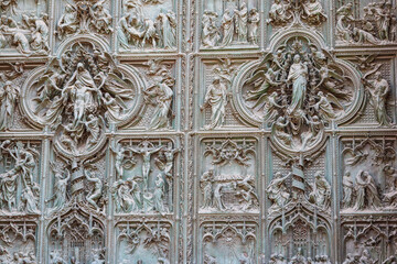 Detail of a bronze door of Milan cathedral, Italy
