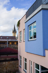 Obraz premium Modern buildings in the historic center of the city next to the baroque castle tower