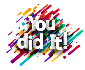 You did it sign over colorful brush strokes background.