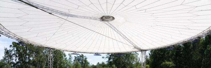 Fototapeta premium Round canopy roof of stretched fabric with lighting