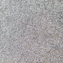 Silver focused glitter texture as background