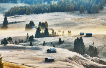 Beautiful view of traditional wooden mountain chalets on scenic Alpe di Siusi with famous Langkofel...