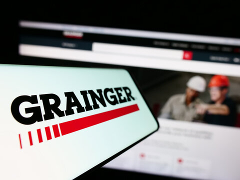 Stuttgart, Germany - 08-12-2023: Smartphone with logo of US industrial supply company W.W. Grainger Inc. on screen in front of website. Focus on center-left of phone display.