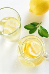 Lemon lemonade on white background. Cold summer drink
